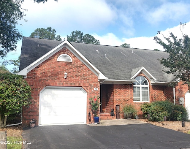 9 Pier, New Bern, NC 28562 - ranch-style home with a shingled roof, brick siding, asphalt driveway, and a garage