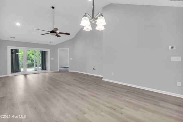 6468 Merceron St SW, Ocean Isle Beach, NC 28469 - unfurnished living room featuring light wood finished floors, a chandelier, a ceiling fan, high vaulted ceiling, and recessed lighting