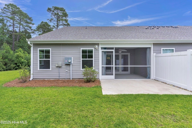 6468 Merceron St SW, Ocean Isle Beach, NC 28469 - rear view of house featuring a sunroom, a patio, a ceiling fan, and a shingled roof