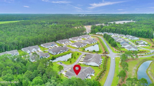 6468 Merceron St SW, Ocean Isle Beach, NC 28469 - aerial view of residential area featuring a heavily wooded area and a nearby body of water