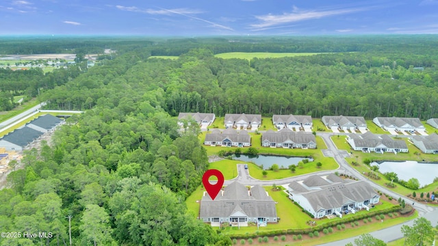 6468 Merceron St SW, Ocean Isle Beach, NC 28469 - aerial perspective of suburban area featuring a forest and a nearby body of water