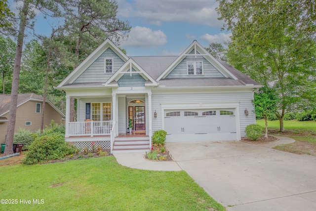 2 Tyler Way, Pinehurst, NC 28374 - view of front of home with covered porch, a front yard, concrete driveway, and an attached garage