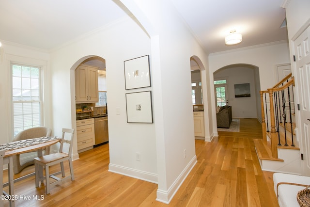2 Tyler Way, Pinehurst, NC 28374 - hallway featuring crown molding, arched walkways, light wood-style floors, and healthy amount of natural light