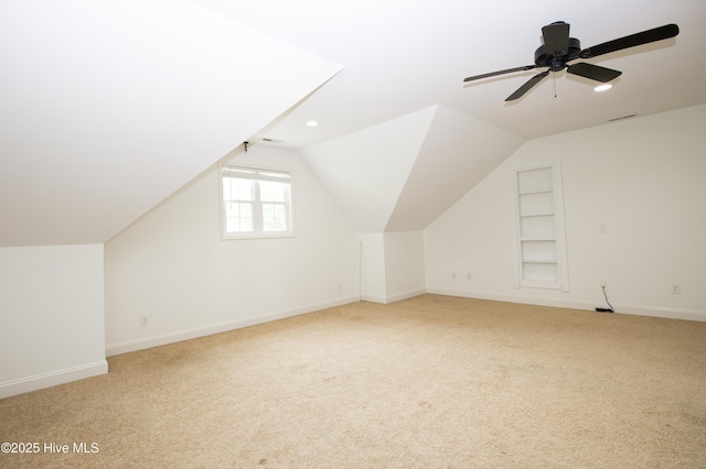 2 Tyler Way, Pinehurst, NC 28374 - bonus room featuring light carpet, built in shelves, ceiling fan, and lofted ceiling