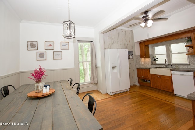 615 E Main St, Aberdeen, NC 28315 - dining area featuring light wood finished floors, ceiling fan, wainscoting, and crown molding