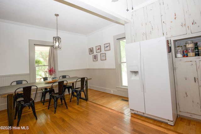 615 E Main St, Aberdeen, NC 28315 - dining space with light wood-type flooring, a wainscoted wall, and crown molding