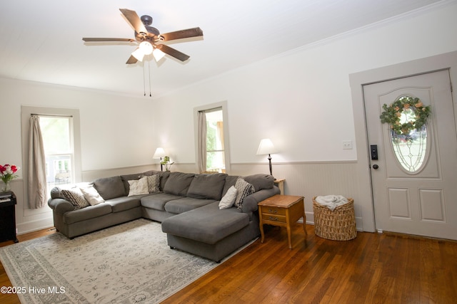 615 E Main St, Aberdeen, NC 28315 - living room featuring healthy amount of natural light, wood finished floors, ceiling fan, a wainscoted wall, and crown molding