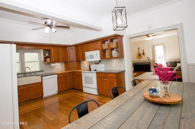 615 E Main St, Aberdeen, NC 28315 - kitchen with white appliances, open shelves, a ceiling fan, brown cabinets, and light wood-style flooring