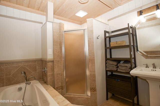 615 E Main St, Aberdeen, NC 28315 - bathroom featuring a shower stall, a bath, and wooden ceiling
