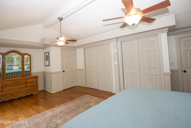 615 E Main St, Aberdeen, NC 28315 - unfurnished bedroom featuring wood finished floors, two closets, and a ceiling fan