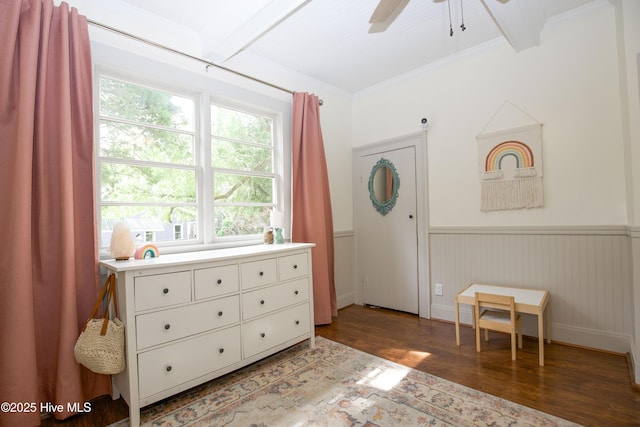 615 E Main St, Aberdeen, NC 28315 - bedroom featuring wood finished floors, a wainscoted wall, beamed ceiling, ornamental molding, and a ceiling fan