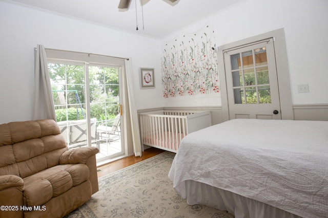 615 E Main St, Aberdeen, NC 28315 - bedroom featuring access to exterior, wood finished floors, and a ceiling fan