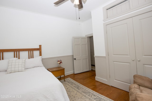 615 E Main St, Aberdeen, NC 28315 - bedroom with light wood-style flooring, a closet, and a ceiling fan