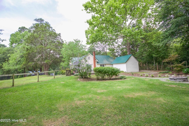 615 E Main St, Aberdeen, NC 28315 - view of green lawn with a shed and view of scattered trees