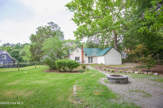 615 E Main St, Aberdeen, NC 28315 - view of yard featuring an outdoor fire pit and view of wooded area