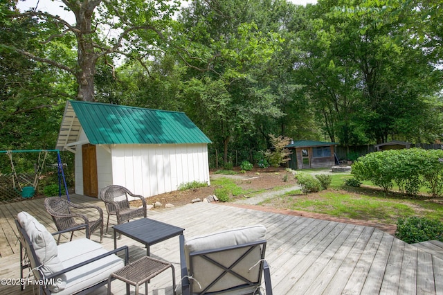 615 E Main St, Aberdeen, NC 28315 - deck featuring a shed and view of scattered trees