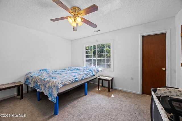 608 Calabash Dr, Hubert, NC 28539 - bedroom with light colored carpet, a textured ceiling, and ceiling fan