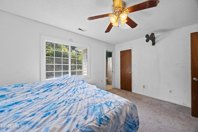 608 Calabash Dr, Hubert, NC 28539 - bedroom featuring a textured ceiling, carpet floors, ceiling fan, and ensuite bath