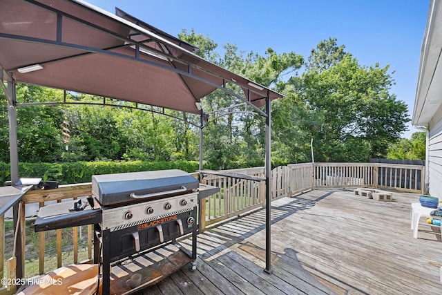 608 Calabash Dr, Hubert, NC 28539 - wooden deck with a grill and view of scattered trees