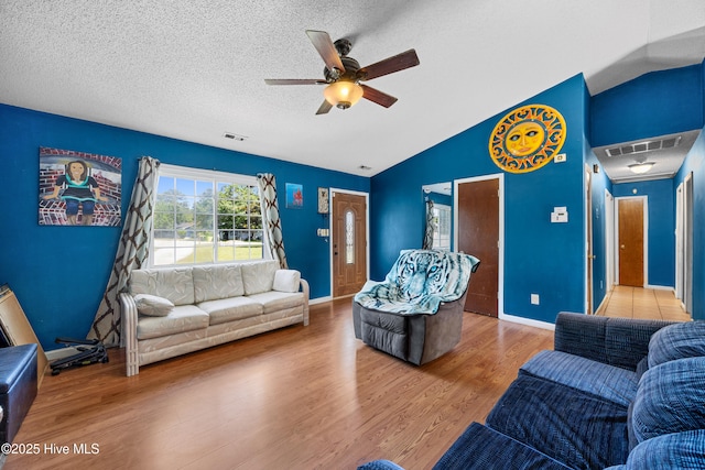 608 Calabash Dr, Hubert, NC 28539 - living area featuring wood finished floors, ceiling fan, lofted ceiling, and a textured ceiling