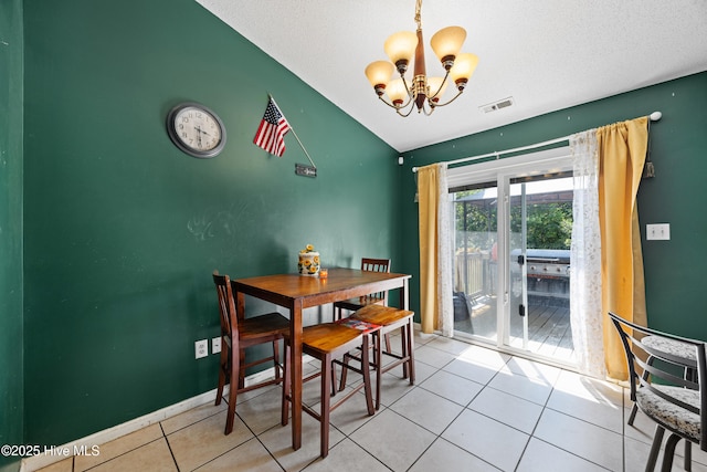 608 Calabash Dr, Hubert, NC 28539 - dining area with a chandelier, tile patterned floors, lofted ceiling, and a textured ceiling
