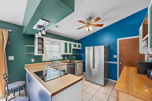 608 Calabash Dr, Hubert, NC 28539 - kitchen featuring appliances with stainless steel finishes, open shelves, lofted ceiling, a ceiling fan, and a peninsula