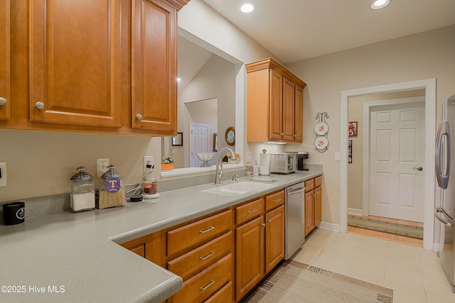 1045 Edenton Dr NW, Calabash, NC 28467 - kitchen with stainless steel appliances, light countertops, recessed lighting, brown cabinets, and light tile patterned flooring