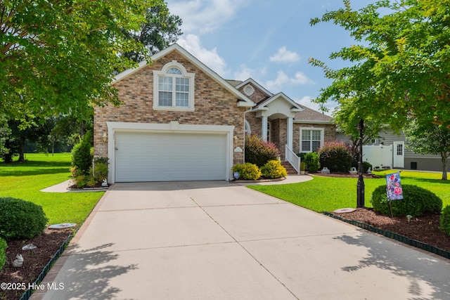 1045 Edenton Dr NW, Calabash, NC 28467 - view of front of house with a front yard, driveway, and brick siding