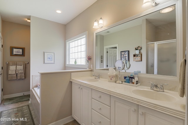 1045 Edenton Dr NW, Calabash, NC 28467 - full bath featuring double vanity, a shower stall, and a garden tub