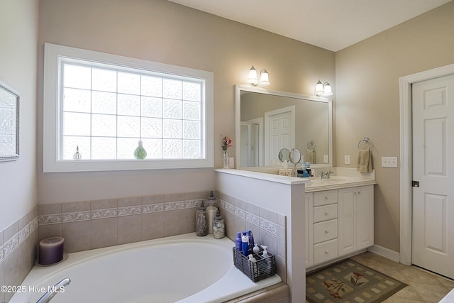1045 Edenton Dr NW, Calabash, NC 28467 - bathroom featuring vanity, a garden tub, and tile patterned flooring
