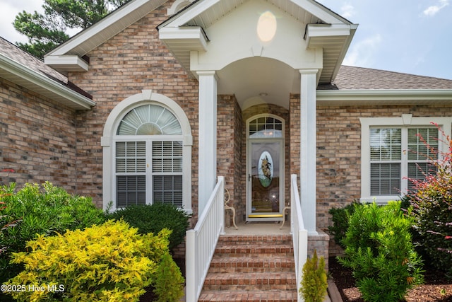 1045 Edenton Dr NW, Calabash, NC 28467 - entrance to property with a shingled roof and brick siding