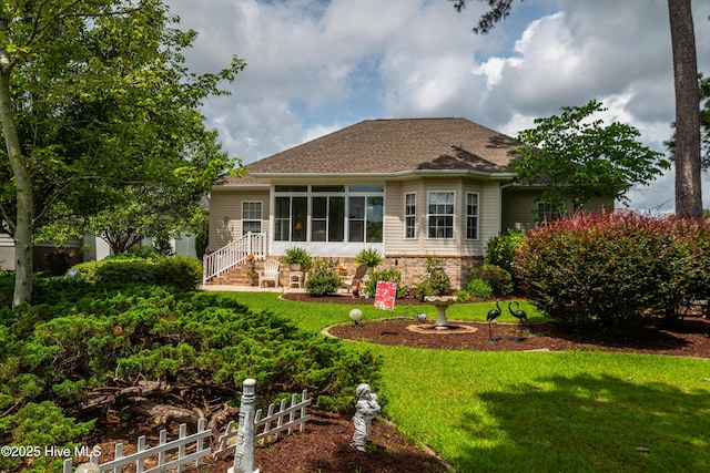 1045 Edenton Dr NW, Calabash, NC 28467 - rear view of property with a sunroom and roof with shingles