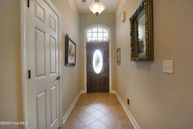 1045 Edenton Dr NW, Calabash, NC 28467 - entryway featuring light tile patterned floors and baseboards