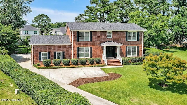 311 Lennox Pl, Wilmington, NC 28412 - colonial home featuring brick siding and a shingled roof