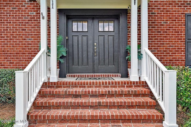 311 Lennox Pl, Wilmington, NC 28412 - property entrance with brick siding and covered porch