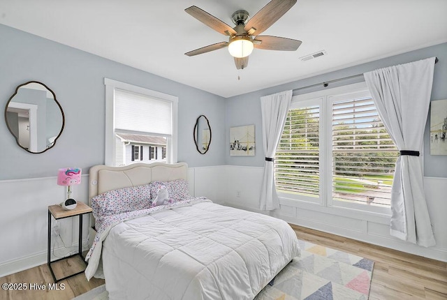 311 Lennox Pl, Wilmington, NC 28412 - bedroom with multiple windows, light wood finished floors, and ceiling fan
