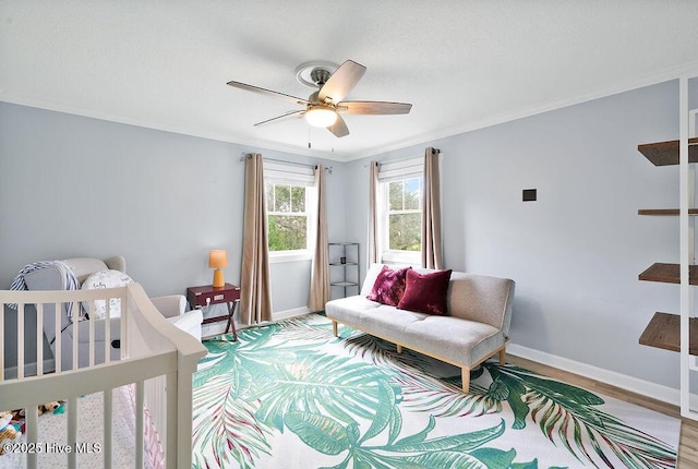 311 Lennox Pl, Wilmington, NC 28412 - bedroom featuring crown molding, light wood-style floors, and a ceiling fan