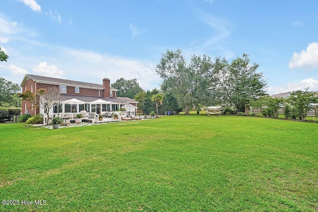 311 Lennox Pl, Wilmington, NC 28412 - view of grassy yard featuring an outdoor hangout area and a patio area