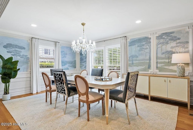 311 Lennox Pl, Wilmington, NC 28412 - dining space with ornamental molding, light wood-style floors, a chandelier, recessed lighting, and a decorative wall