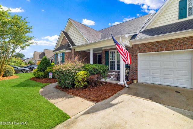 258 Morning View Way, Leland, NC 28451 - view of side of home featuring driveway, brick siding, a shingled roof, and a garage