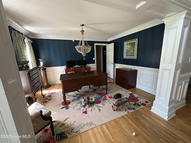 2270 Bella Coola Rd, Lake Waccamaw, NC 28450 - office space featuring wood finished floors, ornate columns, ornamental molding, wainscoting, and a textured ceiling