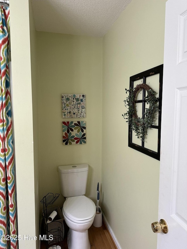 2270 Bella Coola Rd, Lake Waccamaw, NC 28450 - bathroom with wood finished floors, a textured ceiling, and curtained shower