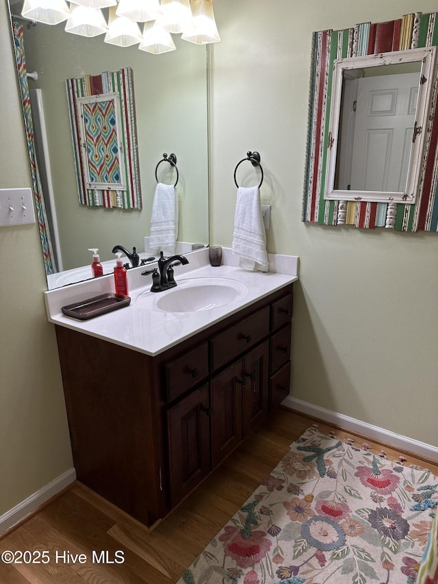 2270 Bella Coola Rd, Lake Waccamaw, NC 28450 - bathroom featuring wood finished floors and vanity