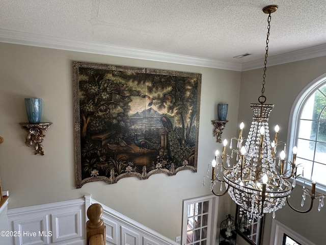 2270 Bella Coola Rd, Lake Waccamaw, NC 28450 - detailed view of a textured ceiling, a chandelier, and crown molding