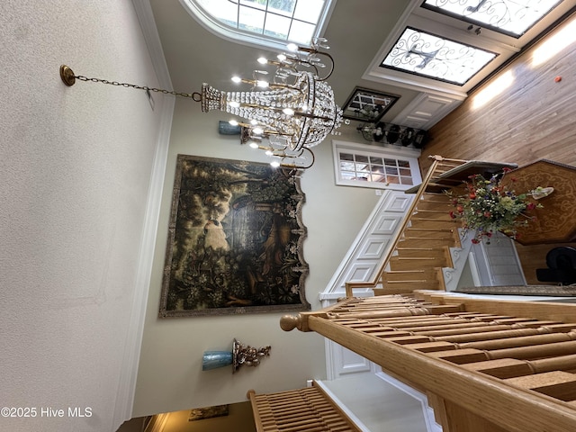 2270 Bella Coola Rd, Lake Waccamaw, NC 28450 - stairway with a chandelier