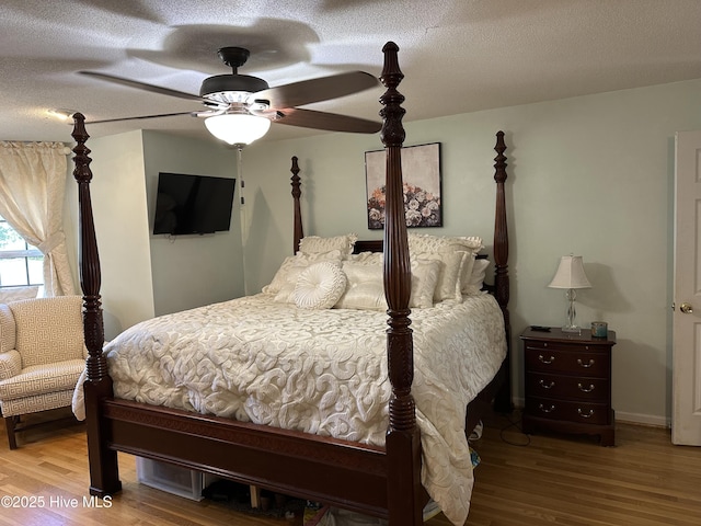 2270 Bella Coola Rd, Lake Waccamaw, NC 28450 - bedroom with wood finished floors, a textured ceiling, and ceiling fan