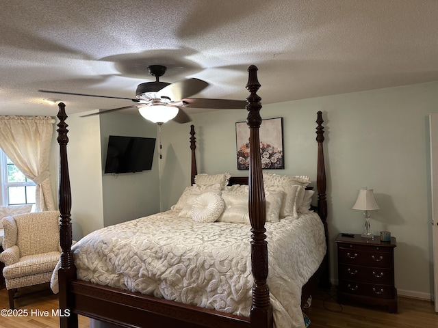 2270 Bella Coola Rd, Lake Waccamaw, NC 28450 - bedroom with wood finished floors and a textured ceiling