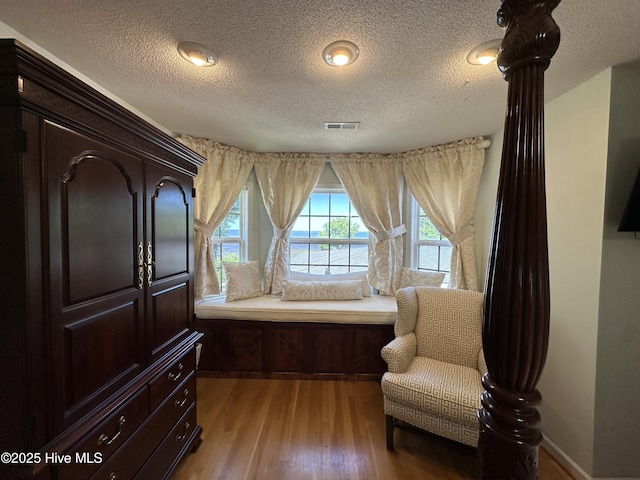 2270 Bella Coola Rd, Lake Waccamaw, NC 28450 - living area with wood finished floors and a textured ceiling