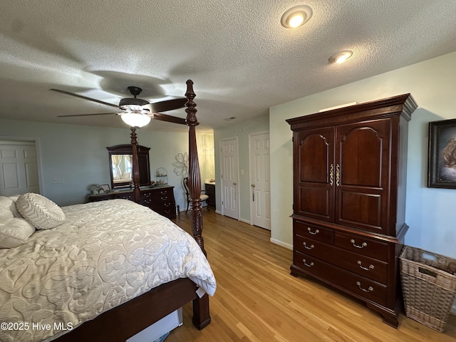 2270 Bella Coola Rd, Lake Waccamaw, NC 28450 - bedroom with light wood-type flooring, a textured ceiling, and a ceiling fan