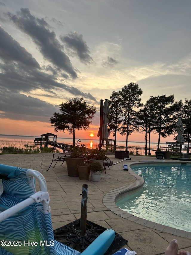 2270 Bella Coola Rd, Lake Waccamaw, NC 28450 - swimming pool with a patio area and a water view